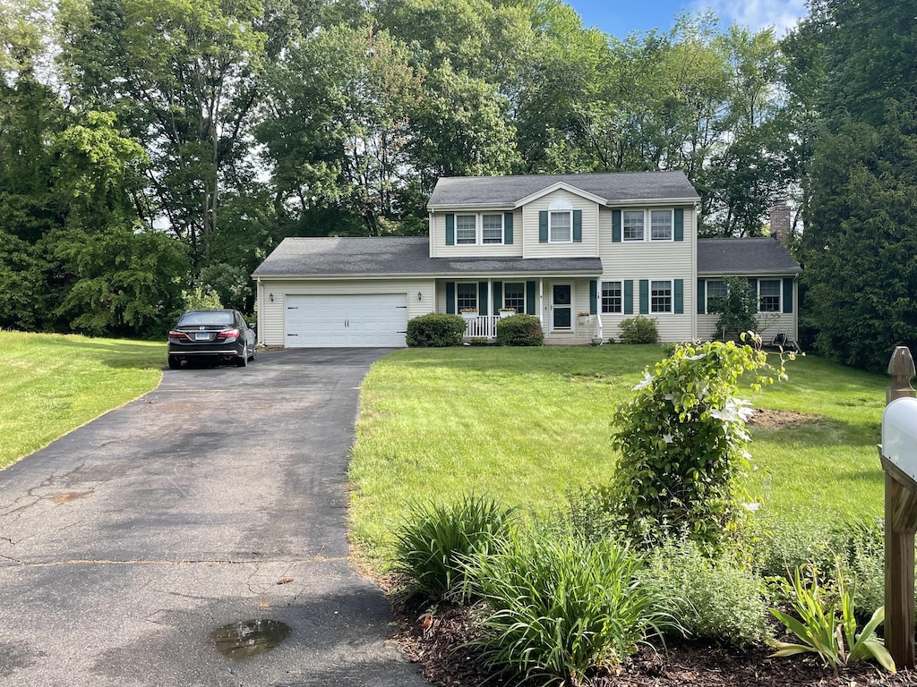 16 Mips Dr, Windsor, CT 06095 - colonial-style house featuring driveway, an attached garage, a front yard, and a chimney