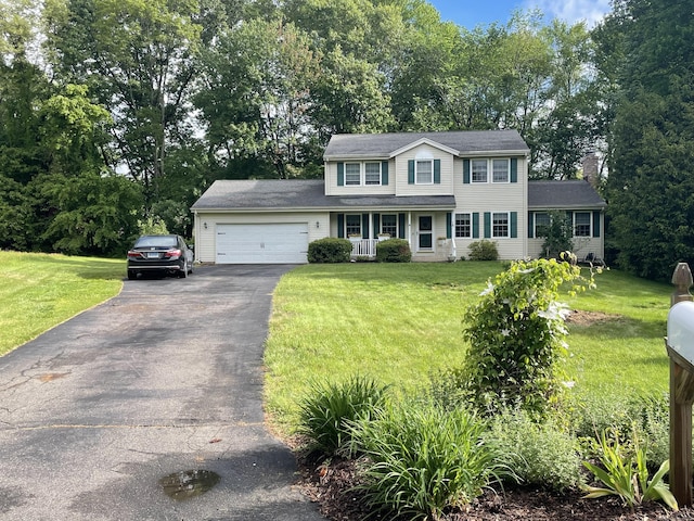 16 Mips Dr, Windsor, CT 06095 - colonial-style house featuring driveway, an attached garage, a front yard, and a chimney
