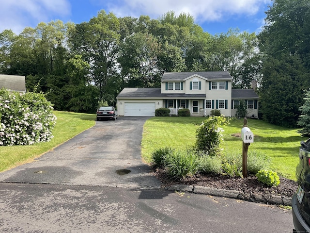 16 Mips Dr, Windsor, CT 06095 - view of front facade featuring a garage, driveway, and a front lawn