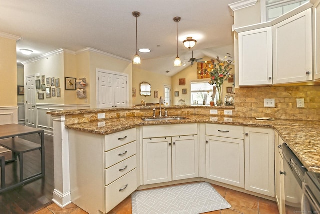 95 S Ridge Ln Unit A203, Berlin, CT 06037 - kitchen featuring a sink, a peninsula, ornamental molding, light tile patterned floors, and light stone counters