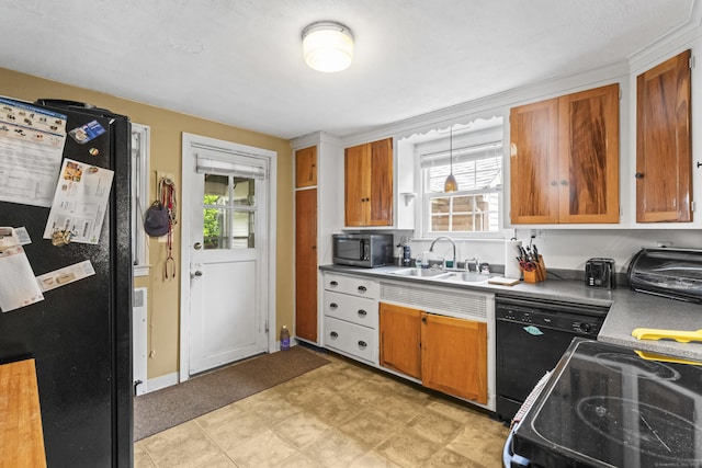 116 Maple St, Wethersfield, CT 06109 - kitchen featuring black appliances, a sink, plenty of natural light, and brown cabinetry