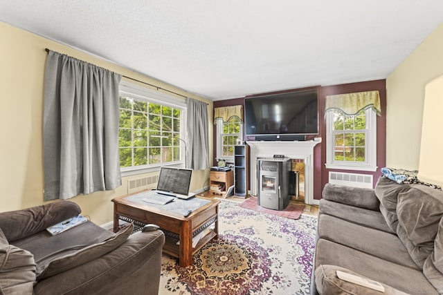 116 Maple St, Wethersfield, CT 06109 - living room featuring a lit fireplace