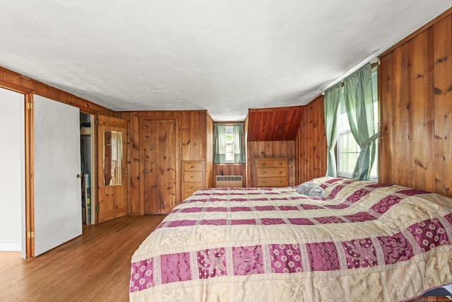 116 Maple St, Wethersfield, CT 06109 - bedroom featuring wood walls, multiple windows, wood finished floors, and radiator
