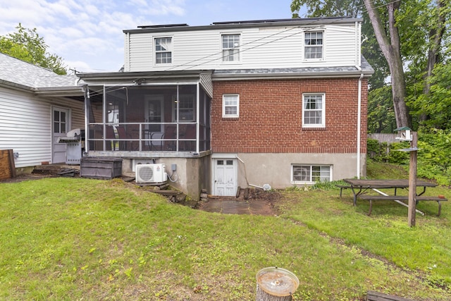 116 Maple St, Wethersfield, CT 06109 - back of property with ac unit, a sunroom, a yard, and brick siding
