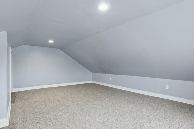 8 3rd St, Norwich, CT 06360 - additional living space with vaulted ceiling, carpet floors, baseboards, and recessed lighting