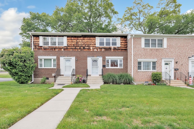 77 Shea Ave Unit 77, Milford, CT 06460 - townhome / multi-family property featuring a front yard, crawl space, and brick siding