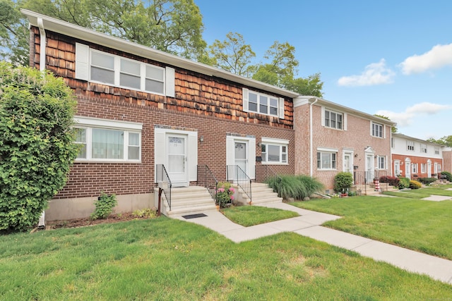 77 Shea Ave Unit 77, Milford, CT 06460 - townhome / multi-family property featuring brick siding, entry steps, and a front yard