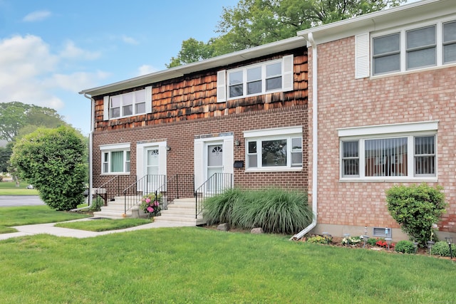 77 Shea Ave Unit 77, Milford, CT 06460 - view of property with a front yard and brick siding