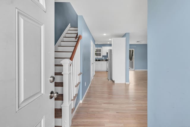 77 Shea Ave Unit 77, Milford, CT 06460 - entryway featuring light wood-style flooring, stairs, baseboards, and recessed lighting
