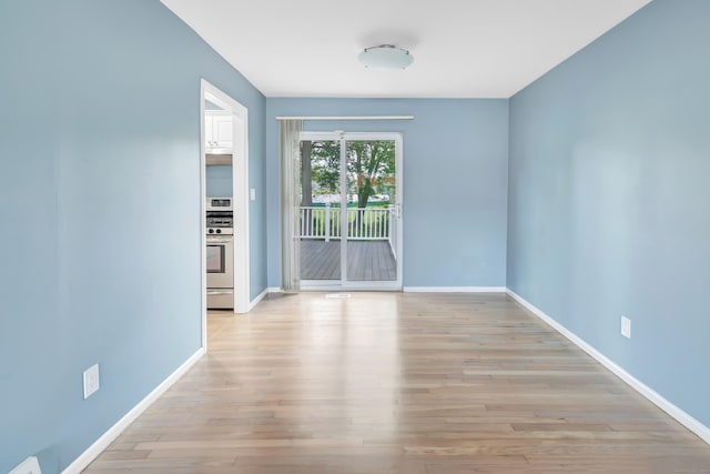 77 Shea Ave Unit 77, Milford, CT 06460 - empty room featuring baseboards and light wood-style floors