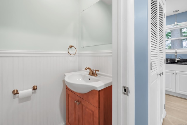 77 Shea Ave Unit 77, Milford, CT 06460 - bathroom with vanity, wainscoting, and ceiling fan