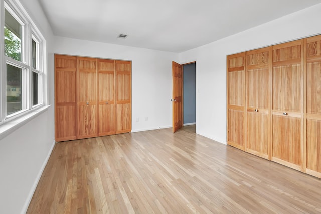 77 Shea Ave Unit 77, Milford, CT 06460 - unfurnished bedroom with light wood-style floors and baseboards