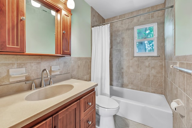 77 Shea Ave Unit 77, Milford, CT 06460 - bathroom with vanity, toilet, tile walls, shower / bath combo, and tile patterned floors