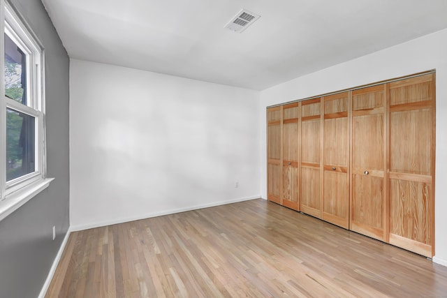 77 Shea Ave Unit 77, Milford, CT 06460 - unfurnished bedroom with light wood-style floors and baseboards