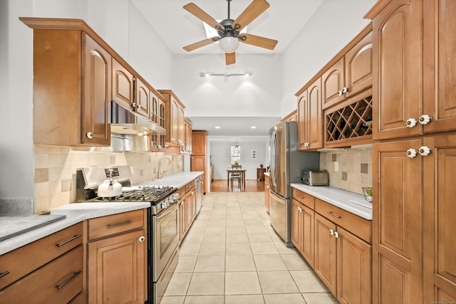 17 Chester Rd, Easton, CT 06612 - kitchen featuring stainless steel appliances, under cabinet range hood, light countertops, high vaulted ceiling, and a ceiling fan