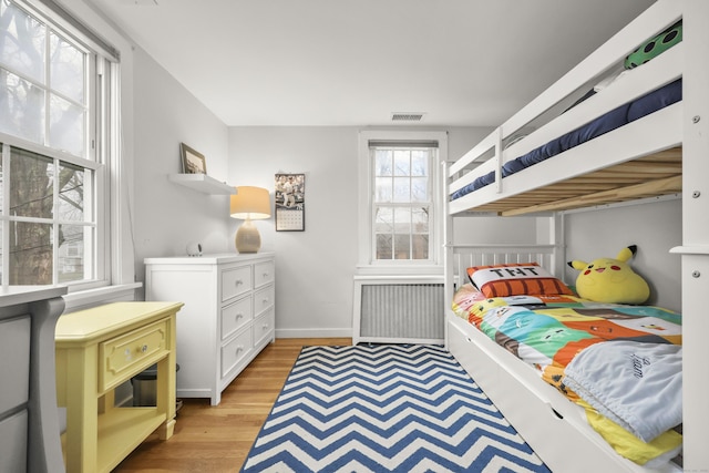 17 Chester Rd, Easton, CT 06612 - bedroom with radiator heating unit, light wood-type flooring, and baseboards