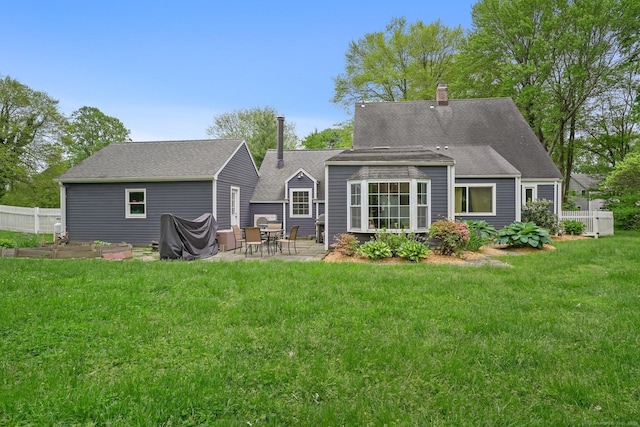 17 Chester Rd, Easton, CT 06612 - rear view of property featuring a patio, a chimney, roof with shingles, and an outbuilding