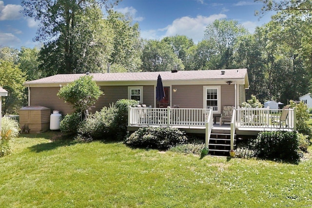 107 Colchester Commons, Colchester, CT 06415 - rear view of house with a yard and a wooden deck