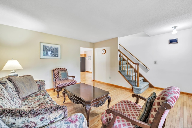 9 Cypress Ln, Trumbull, CT 06611 - living room with baseboards, light wood-style flooring, and stairway