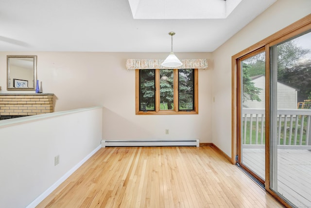 9 Cypress Ln, Trumbull, CT 06611 - unfurnished dining area featuring a baseboard radiator, a skylight, wood-type flooring, and baseboards