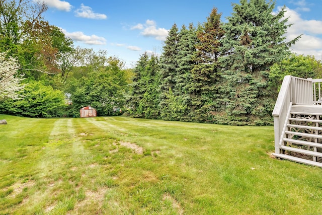 9 Cypress Ln, Trumbull, CT 06611 - view of green lawn featuring stairway and a deck