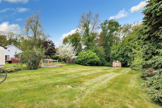 9 Cypress Ln, Trumbull, CT 06611 - view of green lawn with a vegetable garden and view of scattered trees