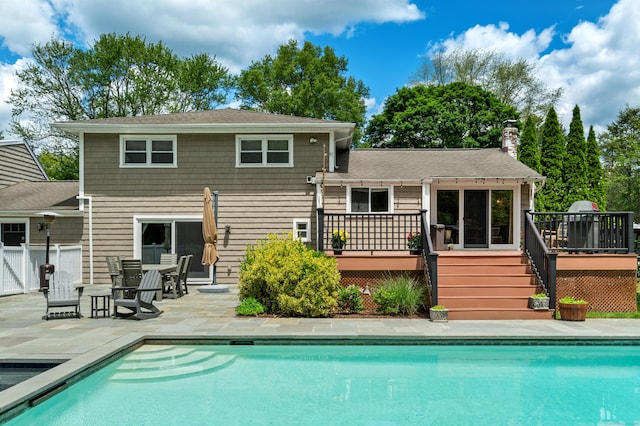 19 Huckleberry Dr S, Norwalk, CT 06850 - rear view of house with a deck, an outdoor pool, and a patio