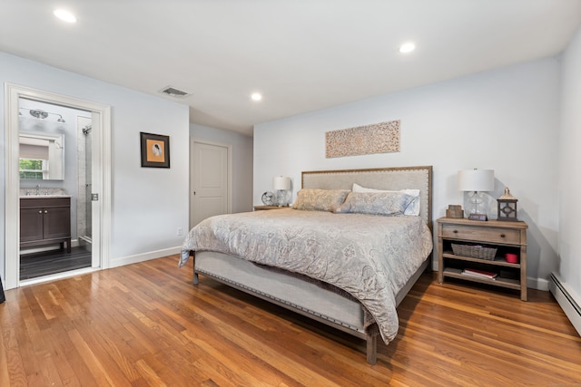 19 Huckleberry Dr S, Norwalk, CT 06850 - bedroom featuring light wood-type flooring, a sink, baseboards, recessed lighting, and baseboard heating