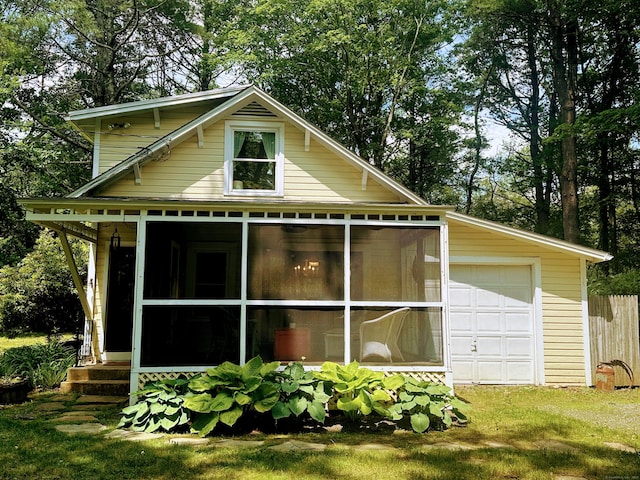81 Milton Rd, Goshen, CT 06756 - rear view of house with a sunroom and a garage