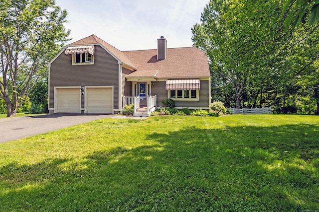 131 Spring Brook Dr, Middletown, CT 06457 - view of front of property with a chimney, driveway, a front yard, and a shingled roof