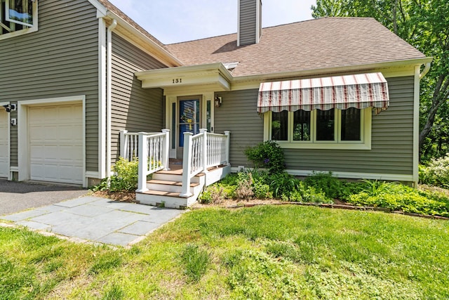131 Spring Brook Dr, Middletown, CT 06457 - view of front of house featuring a chimney, a front yard, and a shingled roof