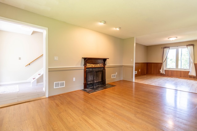 131 Spring Brook Dr, Middletown, CT 06457 - unfurnished living room featuring wood finished floors, wainscoting, stairs, and a tiled fireplace