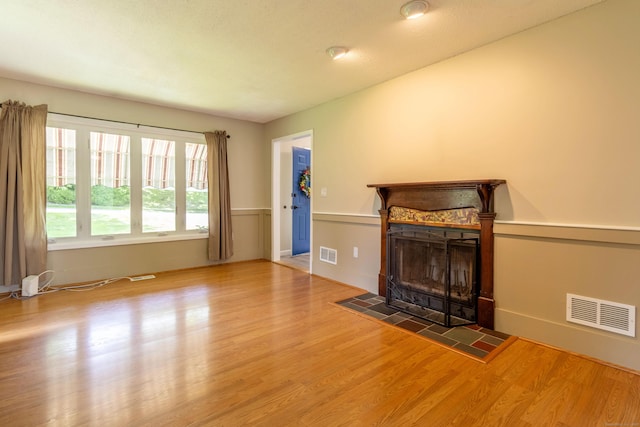 131 Spring Brook Dr, Middletown, CT 06457 - unfurnished living room featuring a fireplace and wood finished floors
