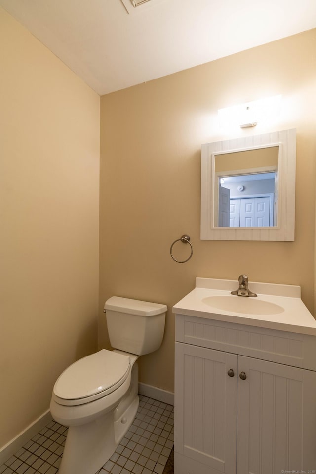 131 Spring Brook Dr, Middletown, CT 06457 - half bath featuring toilet, vanity, baseboards, and tile patterned floors