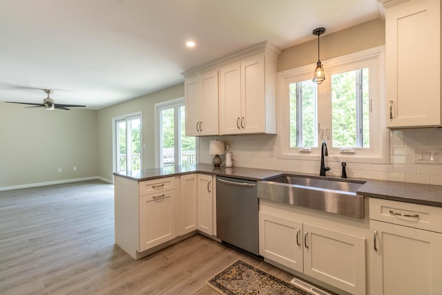 131 Spring Brook Dr, Middletown, CT 06457 - kitchen with dishwasher, a sink, backsplash, dark countertops, and recessed lighting