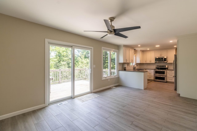 131 Spring Brook Dr, Middletown, CT 06457 - kitchen featuring appliances with stainless steel finishes, a sink, healthy amount of natural light, ceiling fan, and recessed lighting