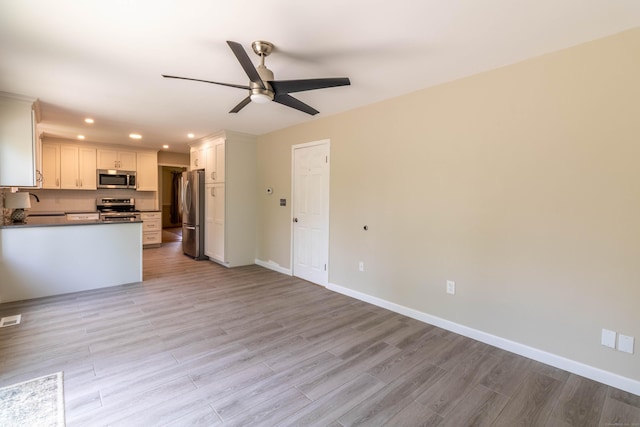 131 Spring Brook Dr, Middletown, CT 06457 - kitchen with stainless steel appliances, recessed lighting, a ceiling fan, light wood finished floors, and baseboards