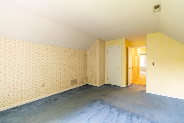 131 Spring Brook Dr, Middletown, CT 06457 - additional living space with vaulted ceiling, carpet floors, and baseboards