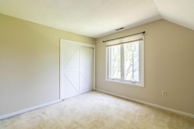 131 Spring Brook Dr, Middletown, CT 06457 - unfurnished bedroom with carpet, vaulted ceiling, and baseboards