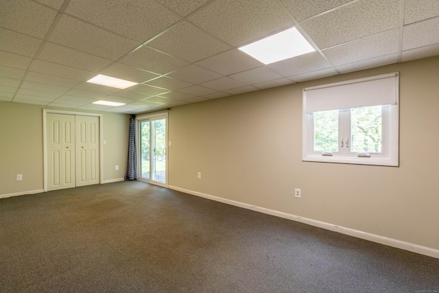 131 Spring Brook Dr, Middletown, CT 06457 - unfurnished room with a drop ceiling, dark colored carpet, and baseboards