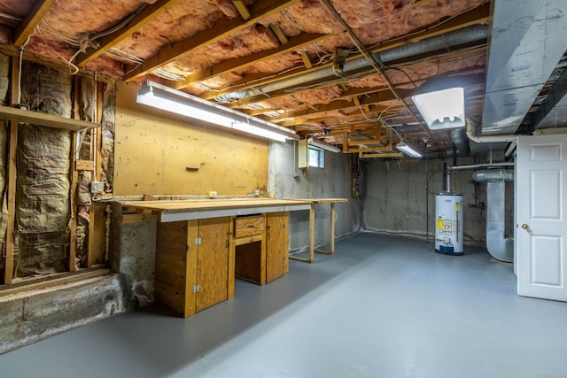 131 Spring Brook Dr, Middletown, CT 06457 - below grade area featuring water heater, heating unit, and a workshop area
