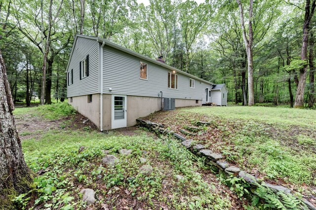 33 White Oak Ln, Woodbridge, CT 06525 - view of home's exterior featuring central AC unit and a chimney