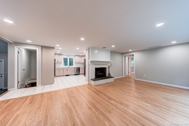 33 White Oak Ln, Woodbridge, CT 06525 - unfurnished living room with light wood-style floors, baseboards, recessed lighting, and a fireplace