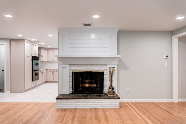 33 White Oak Ln, Woodbridge, CT 06525 - unfurnished living room featuring recessed lighting, light wood-type flooring, a fireplace, and baseboards