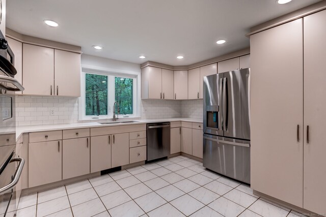 33 White Oak Ln, Woodbridge, CT 06525 - kitchen with appliances with stainless steel finishes, a sink, light countertops, decorative backsplash, and recessed lighting