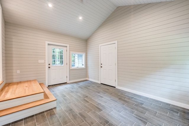33 White Oak Ln, Woodbridge, CT 06525 - doorway with lofted ceiling, baseboards, dark wood-style flooring, recessed lighting, and wood walls