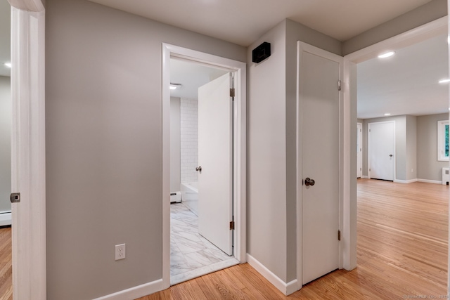 33 White Oak Ln, Woodbridge, CT 06525 - corridor with light wood-type flooring, baseboards, recessed lighting, and a baseboard radiator
