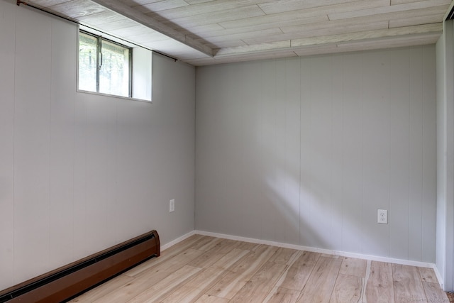 33 White Oak Ln, Woodbridge, CT 06525 - empty room with baseboard heating, light wood-style flooring, and baseboards