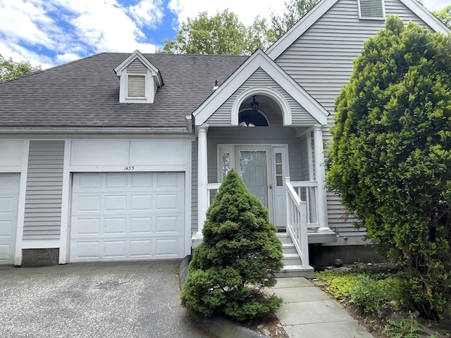1433 Naugatuck Ave Unit 1433, Milford, CT 06461 - view of front of property with driveway, a shingled roof, and a garage