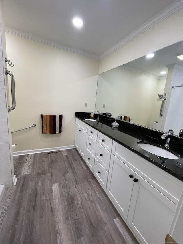 1433 Naugatuck Ave Unit 1433, Milford, CT 06461 - bathroom featuring crown molding, double vanity, wood finished floors, and baseboards